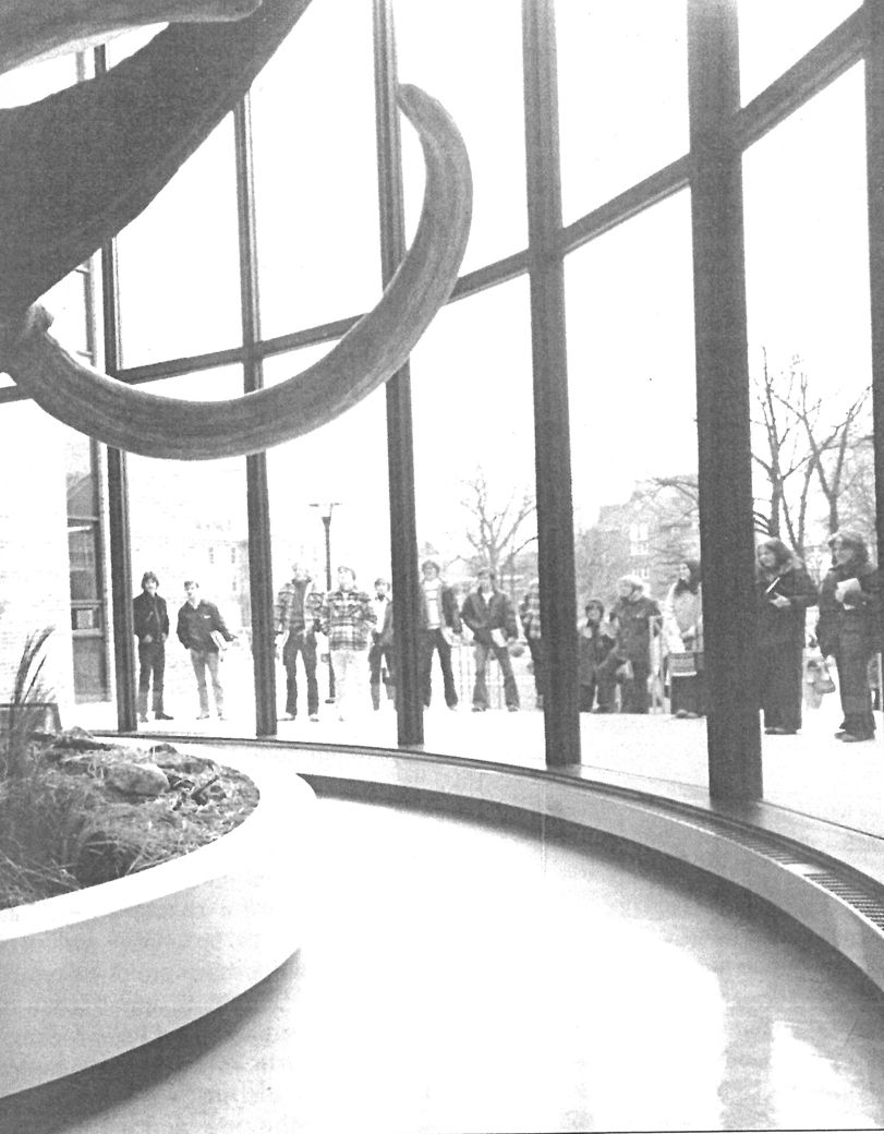 Guests gathered around the Perry Mastodon exhibit to hear the newly recorded narration created by five students from the classes of 1976 and 1977 during their Thanksgiving break.