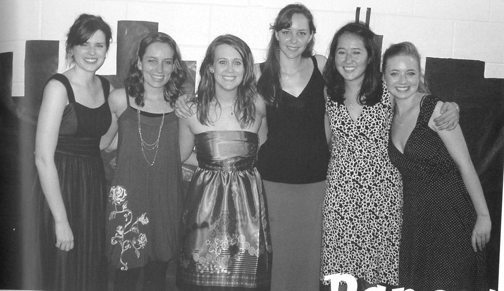 The women of College Union take a moment to pose for a picture at the campus dance they helped organize.