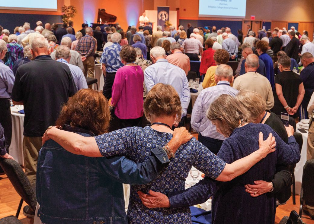 Praying together at the close of the Alumni Weekend luncheon.