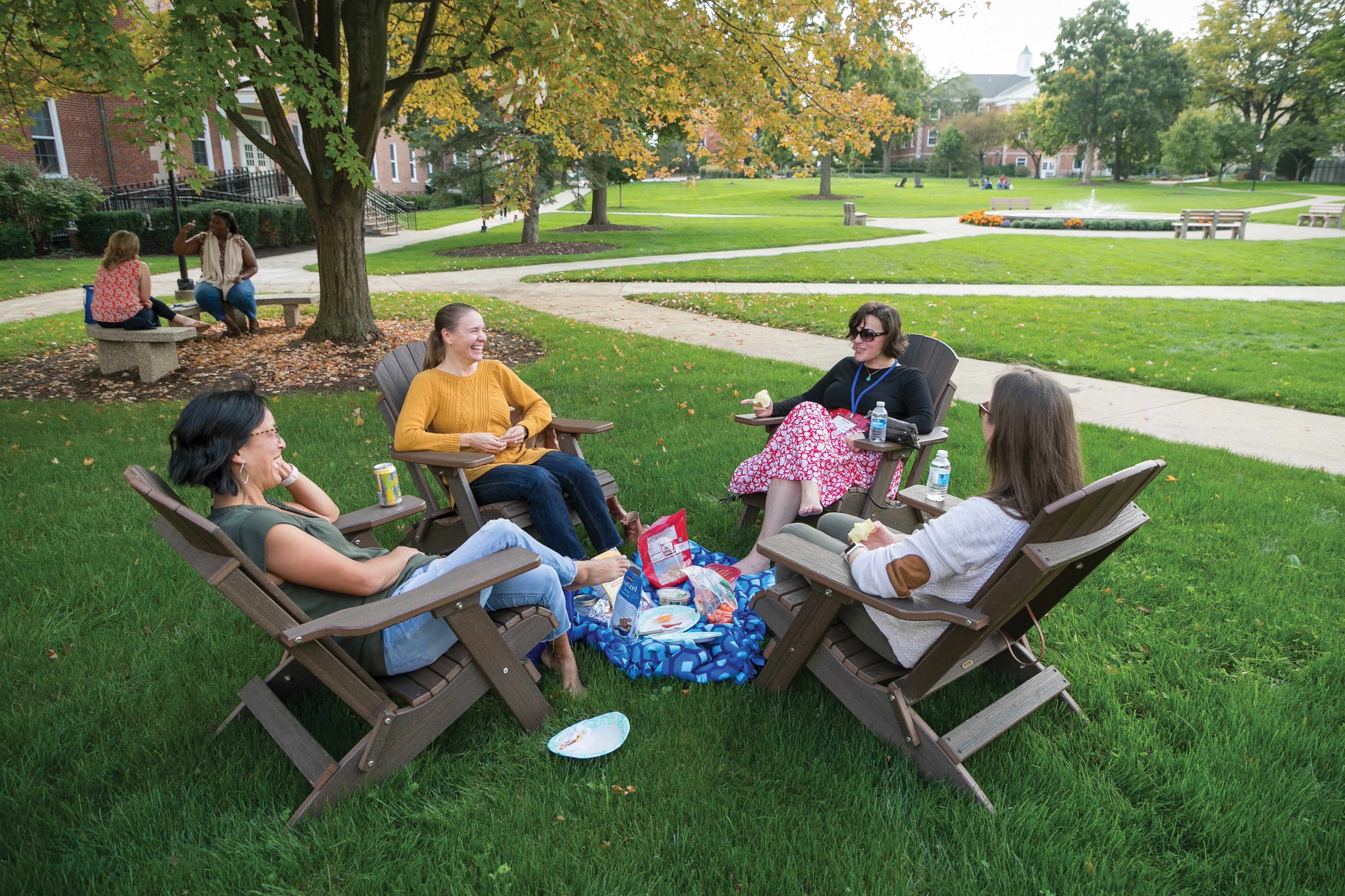 Reconnecting with college friends and roommates on the quad.